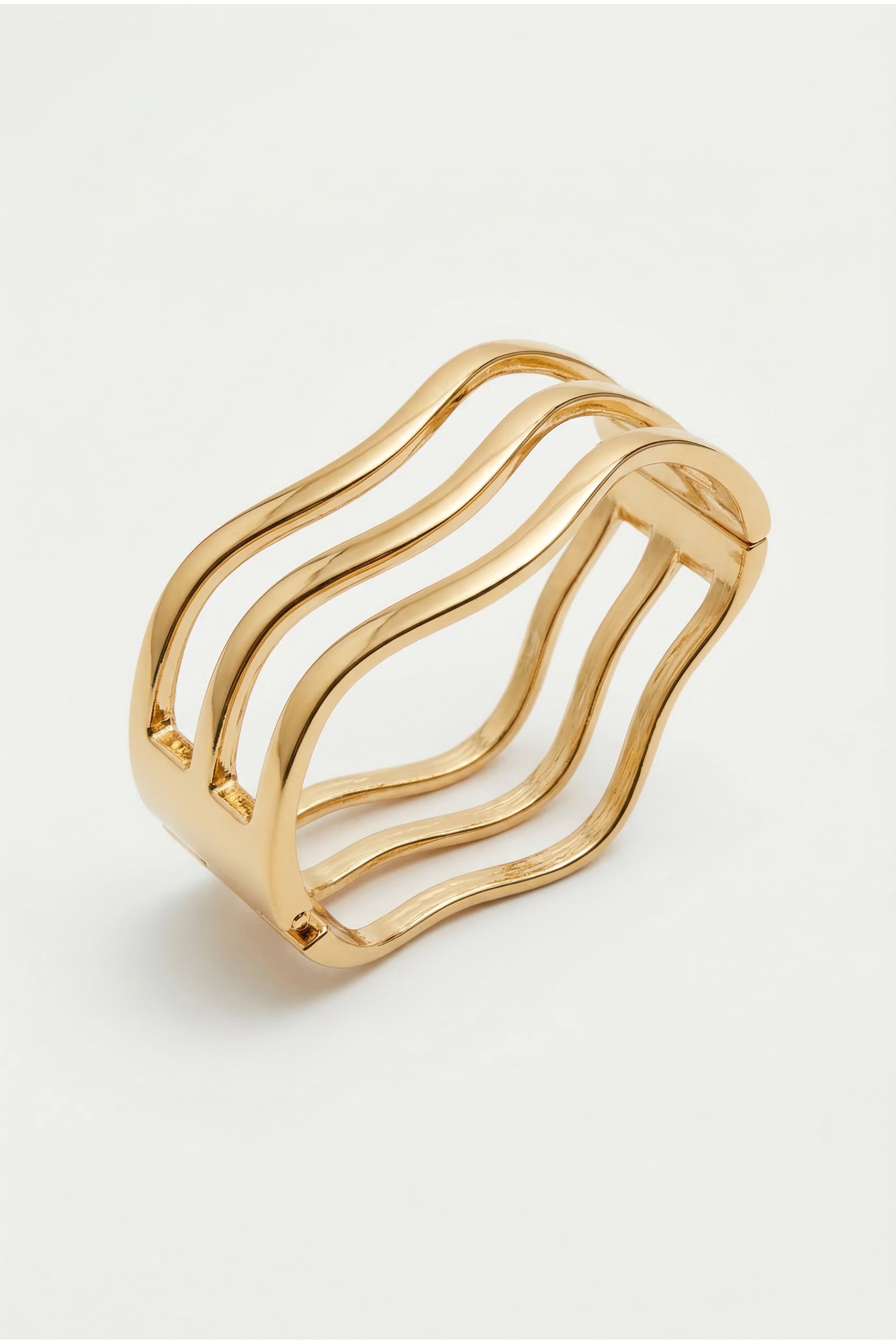 Perforated line cuff bracelet in gold image 1