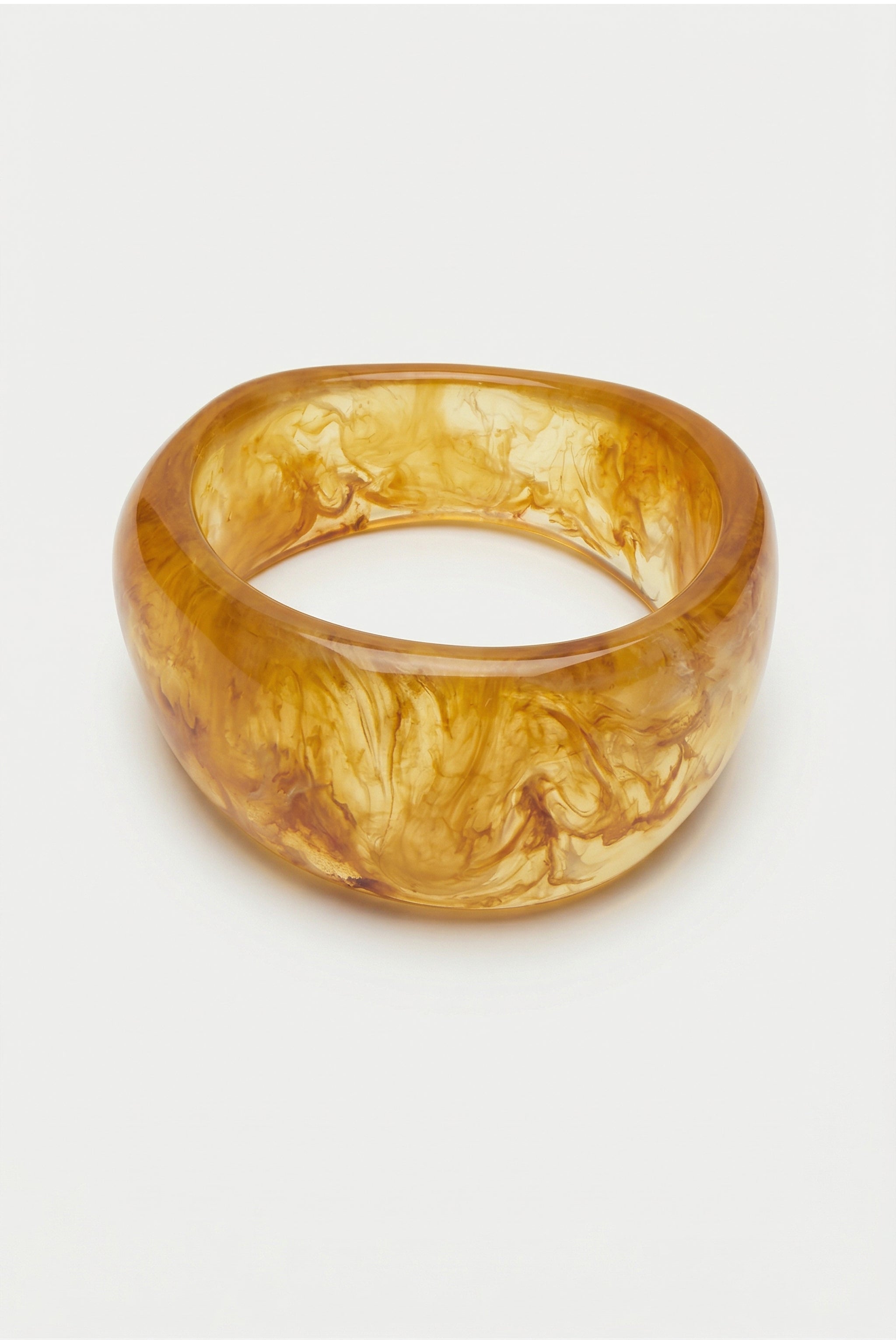Rounded resin cuff bracelet in gold image 1