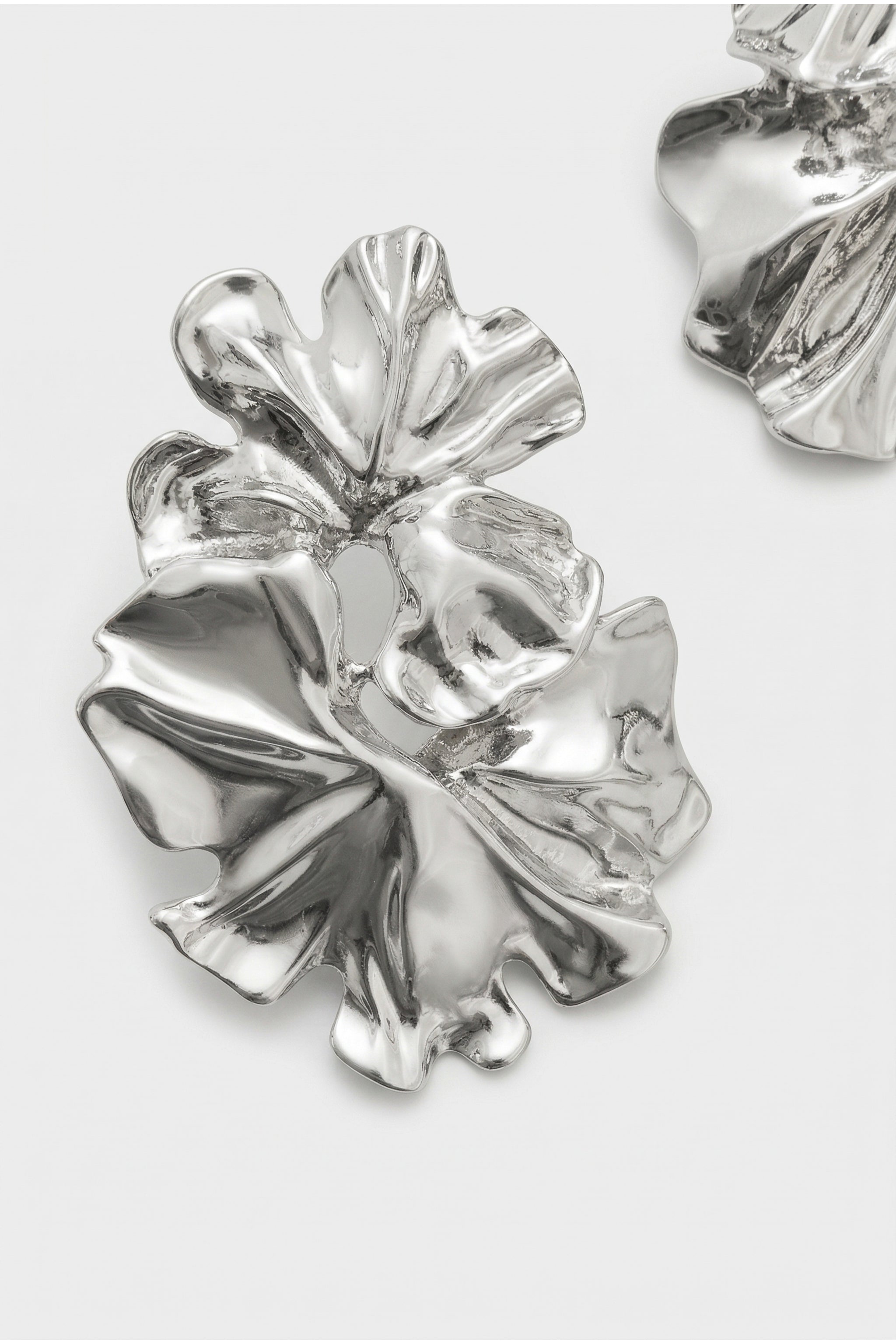 Sculptural floral earrings in silver