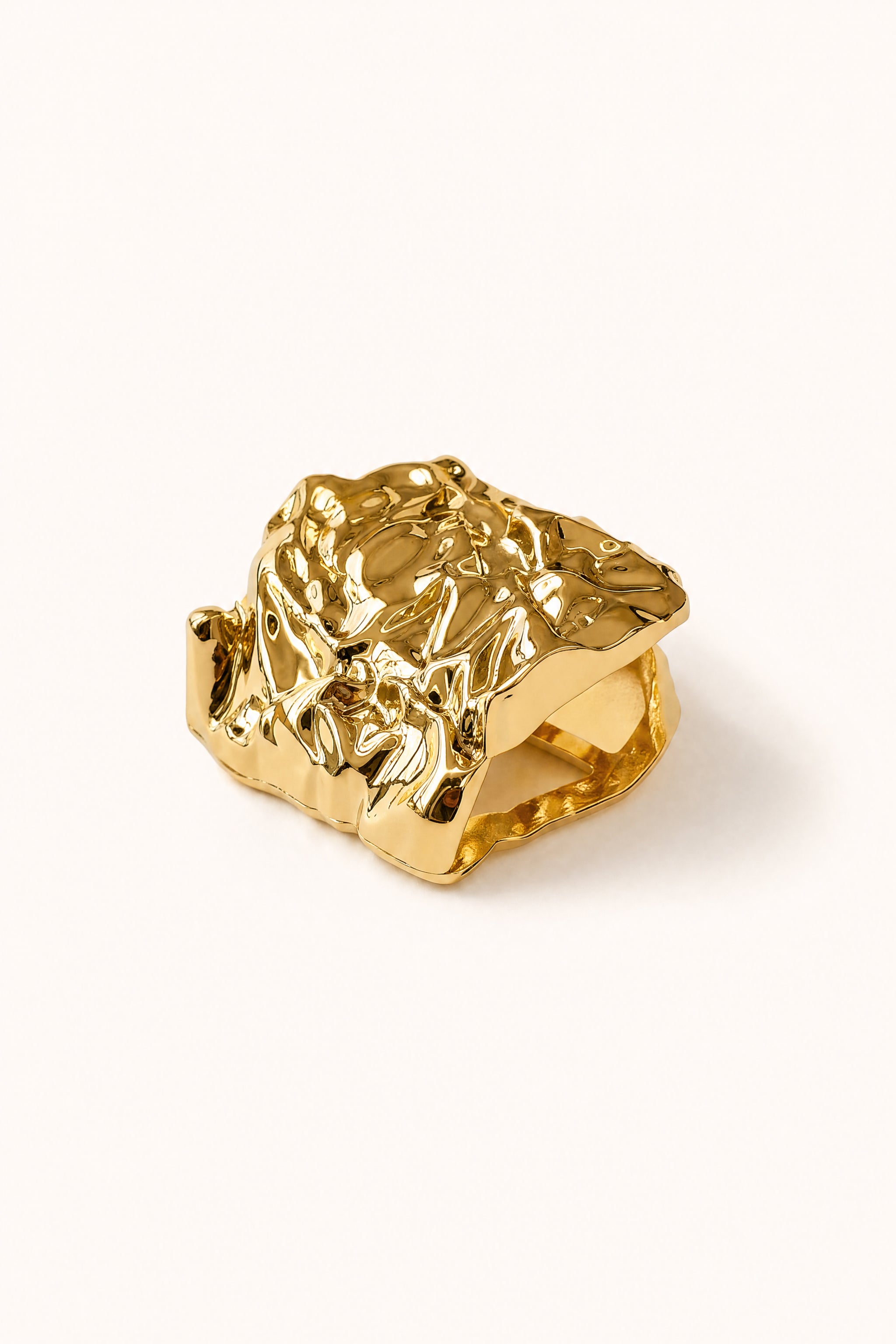 Sculptural hammered scarf ring in gold image 1