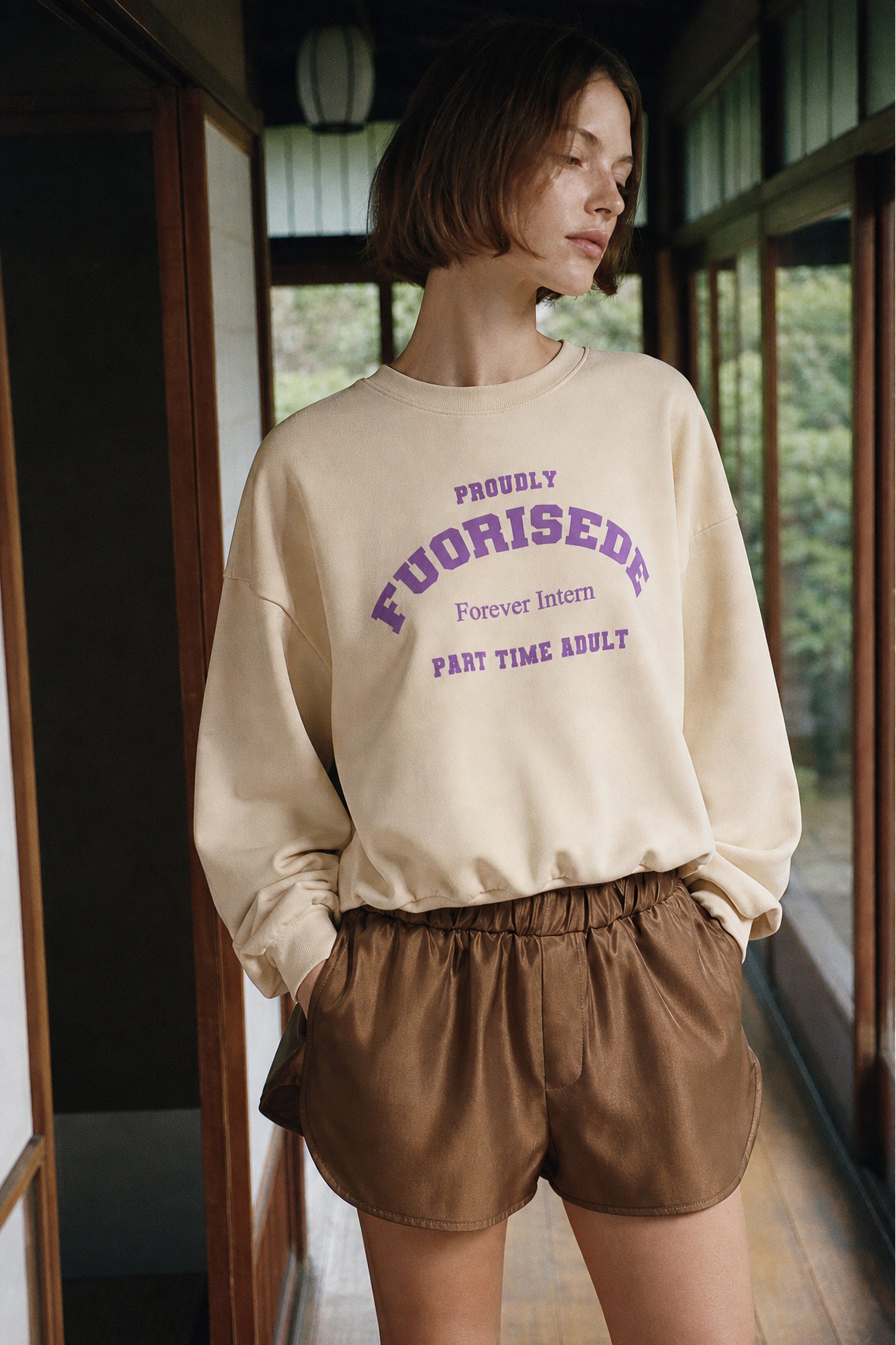Fluid satin pull on shorts in gold editorial image 1