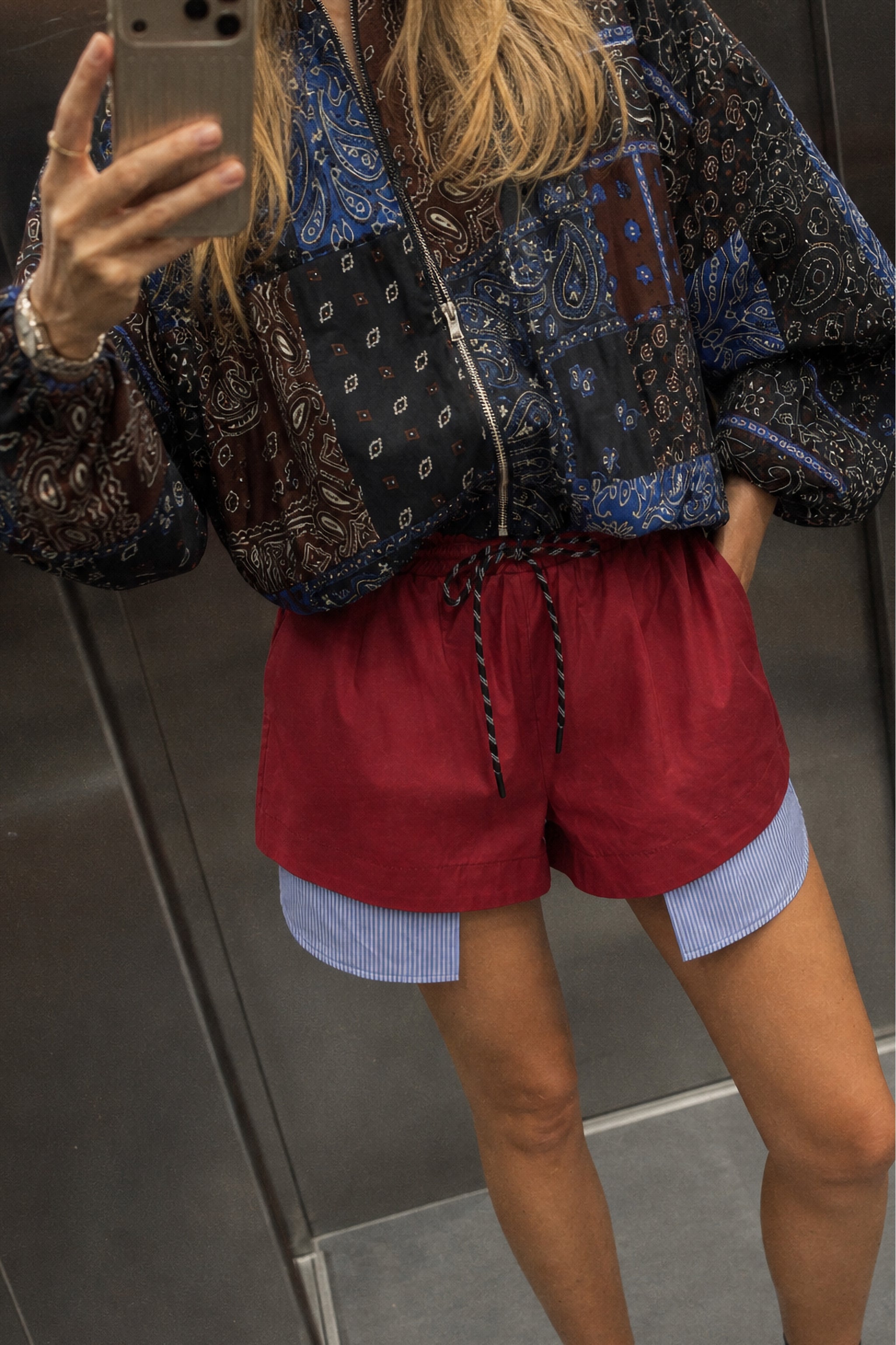 Striped detail cotton shorts in red editorial image 1