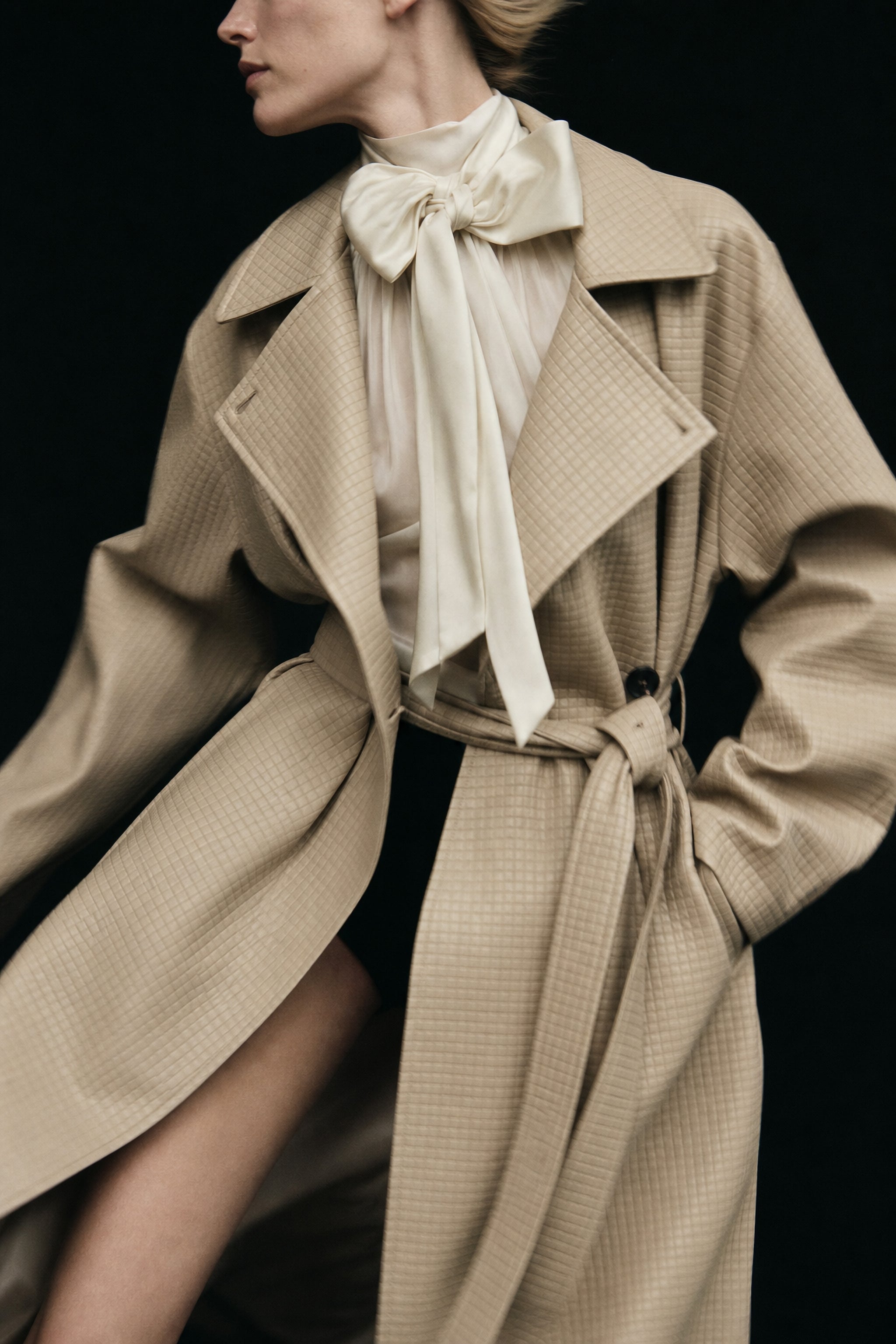 Embossed check faux leather trench coat in beige editorial image 2