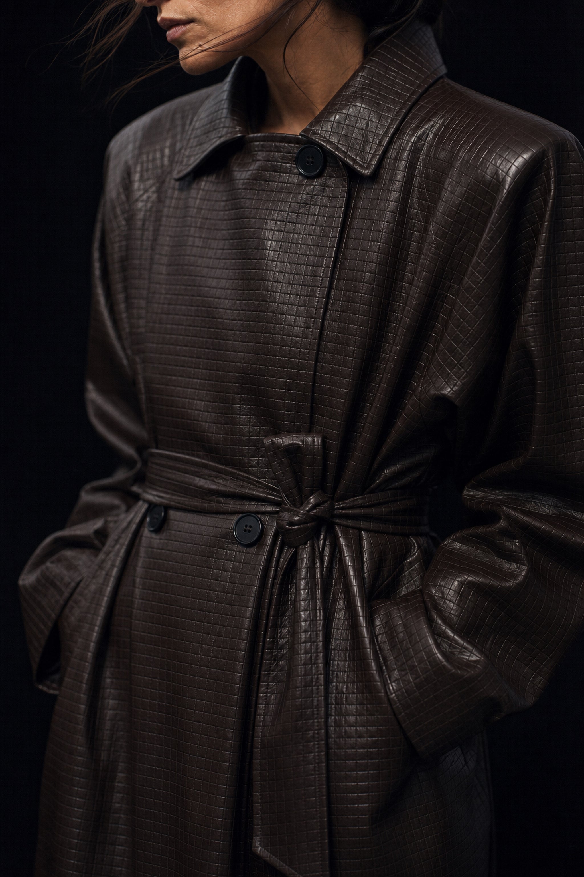 Embossed check faux leather trench coat in brown editorial image 2